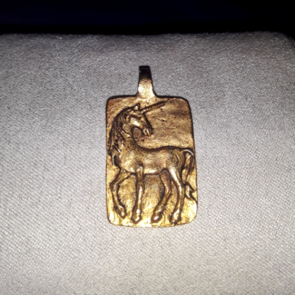 Gold tone pendant